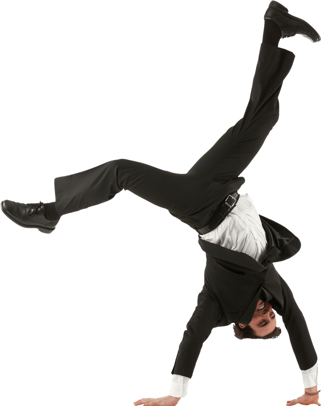 A man in a business suit performs a one-handed cartwheel, smiling confidently while suspended upside down against a transparent background.